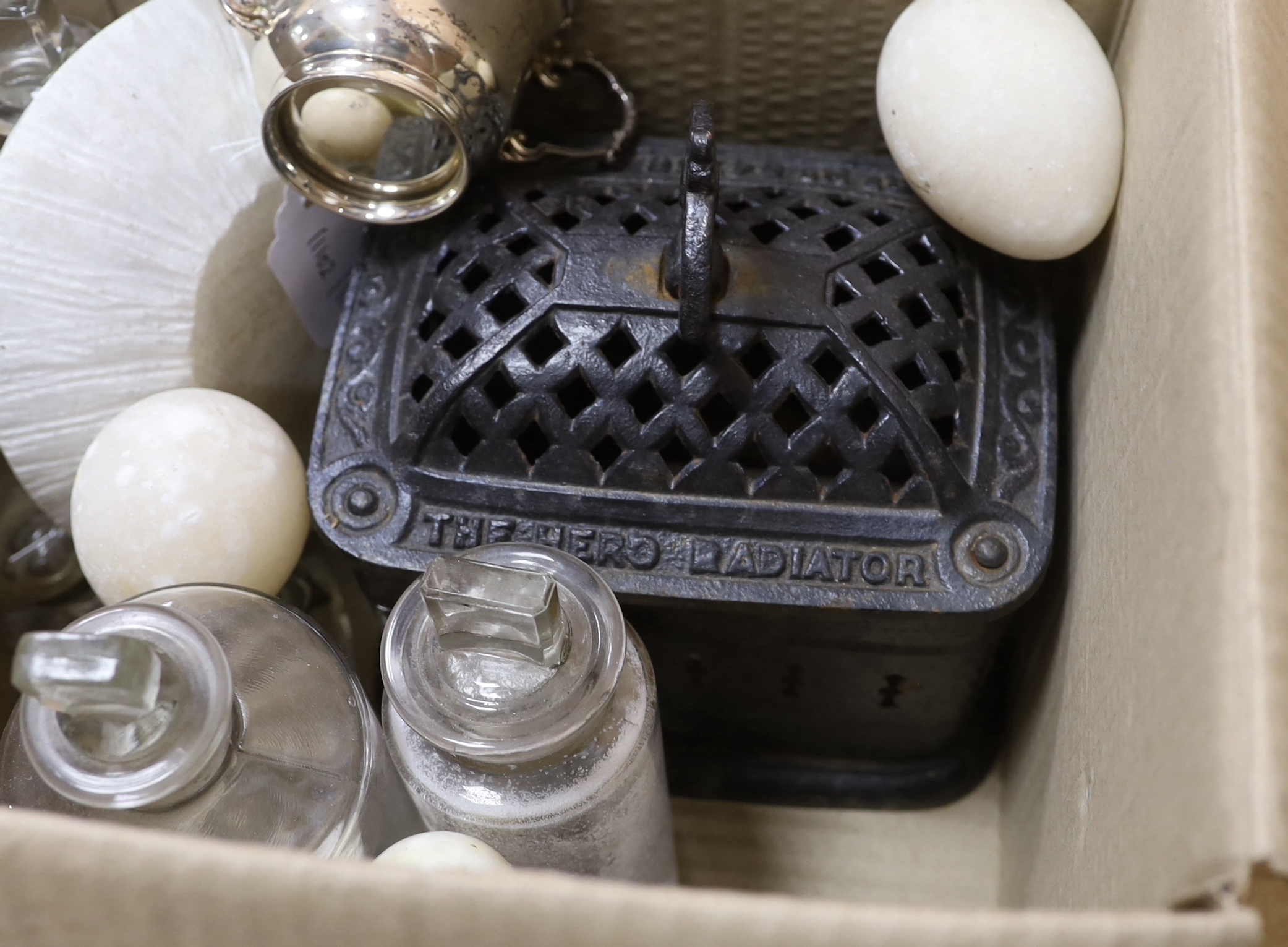 Sundry items including Victorian cast iron 'Hero Radiator', a silver twin handled cup with gilt interior, three apothecary jars